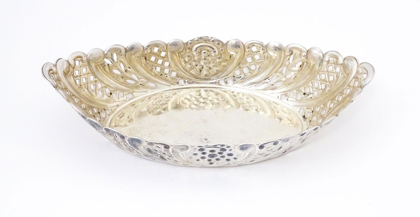 A Victorian silver sweet meat dish of oval form with pierced and embossed decoration. hallmarked (1 of 10)