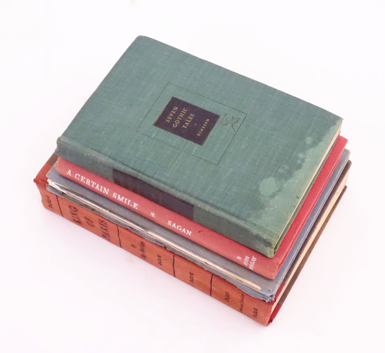 Books: Four assorted books comprising Seven Gothic Tales by Isak Dinesen, 1934; A Certain Smile by: Books: Four assorted books comprising Seven Gothic Tales by Isak Dinesen, 1934; A Certain Smile by Francoise Sagan, 1956; Sonnets from the Portuguese by Elizabeth Barrett Browning, and King of Paris b