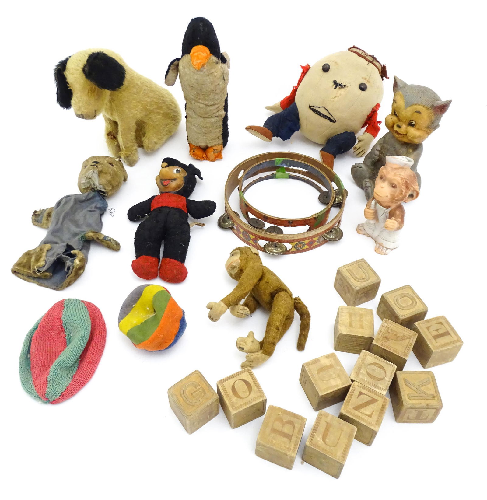 Toys: A quantity of assorted vintage toys, to include a Semco Mickey Mouse, an early 20thC straw: Toys: A quantity of assorted vintage toys, to include a Semco Mickey Mouse, an early 20thC straw filled soft toy modelled as a seated dog, a straw filled model of a monkey / chimpanzee with wired feet