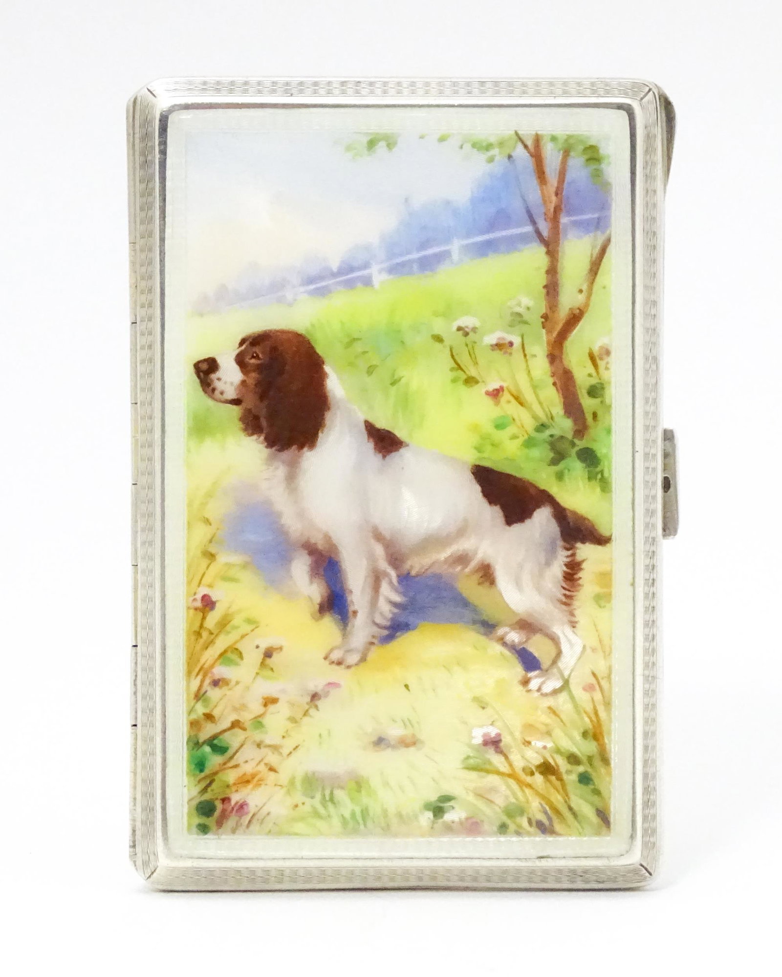 An Art Deco silver cigarette case with enamel Spaniel dog decoration, engine turned detail and (1 of 9)