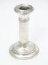 A silver candlestick hallmarked Birmingham 1918.  Approx. 4 1/4" high Please Note - we do not make