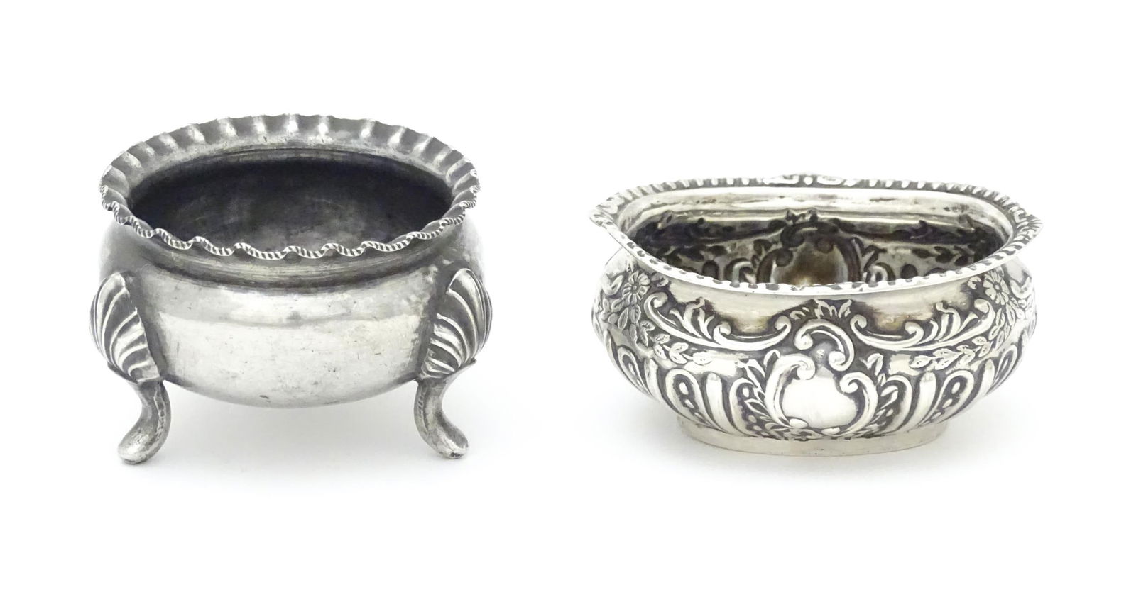 A Victorian silver salt of oval form, hallmarked Birmingham 1898 Maker Henry Matthews. Together with: A Victorian silver salt of oval form, hallmarked Birmingham 1898 Maker Henry Matthews. Together with a silver plate example. Silver salt approx. 2 1/2" wide (2)Please Note - we do not make reference t