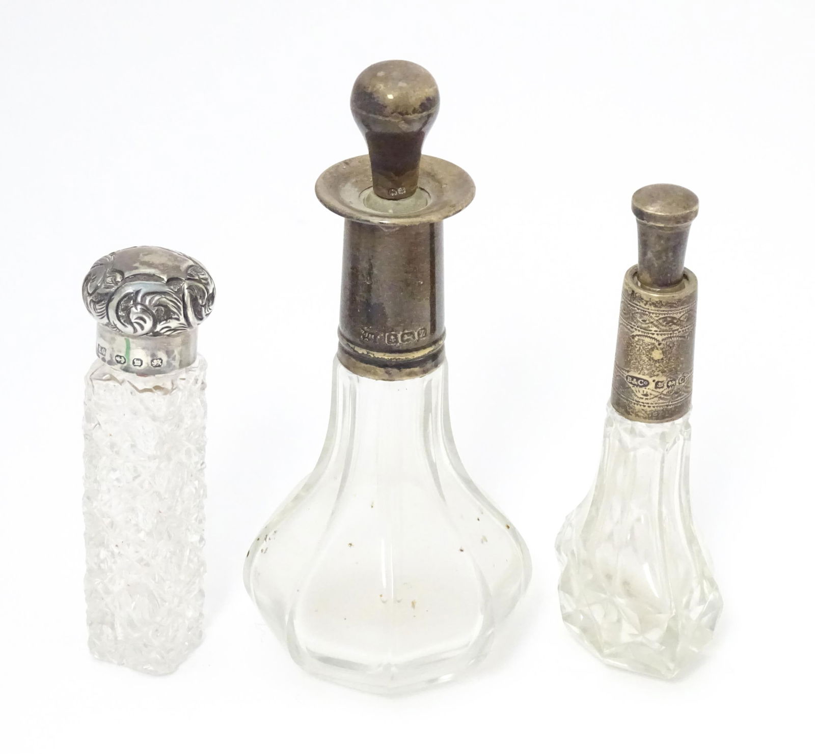 A Victorian cut glass scent / salts bottle with embossed silver top hallmarked Birmingham 1896, (1 of 7)