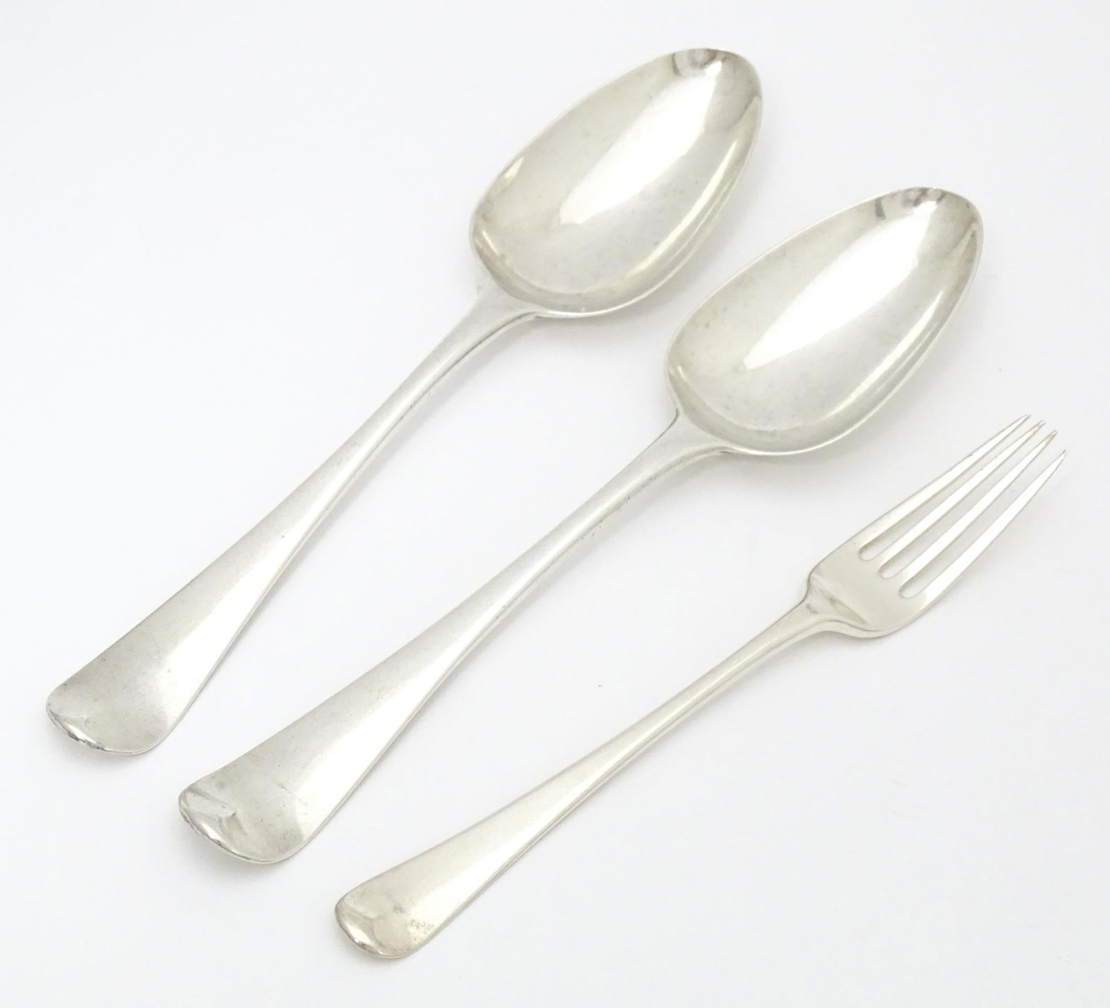 Two George III silver table spoons hallmarked London 1804 maker Christopher & Thomas Wilkes Barker: Two George III silver table spoons hallmarked London 1804 maker Christopher & Thomas Wilkes Barker together with silver dessert fork hallmarked London 1800 maker Thomas Dicks. the spoons approx. 8" lo