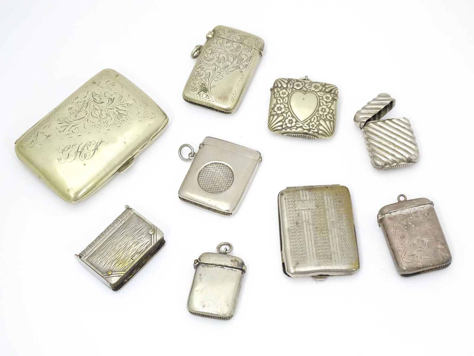 A quantity of assorted silver plate vesta cases, to include one of book form. Together with a silver (1 of 11)