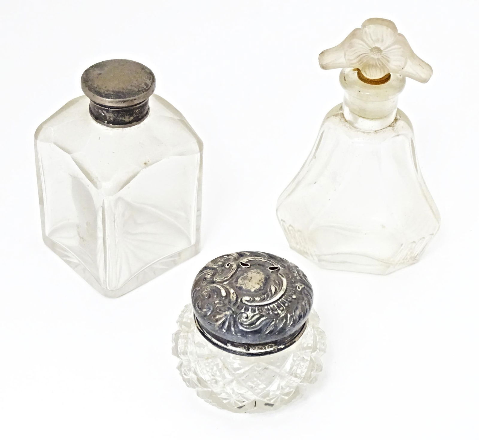 Three various glass scent / dressing table bottles, one with Hallmarked silver top. The tallest 4 (1 of 19)