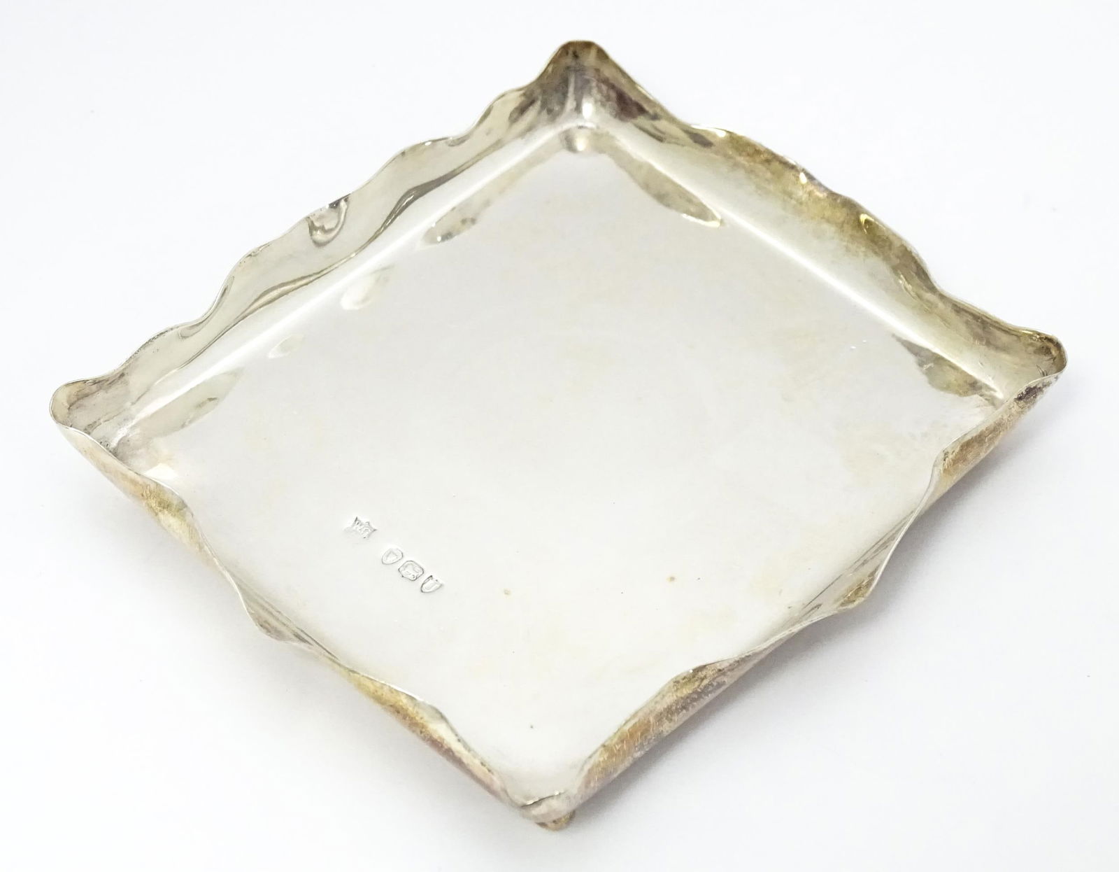 A Victorian silver pin dish of rectangular form raised on four ball feet. Hallmarked London 1895 (1 of 5)