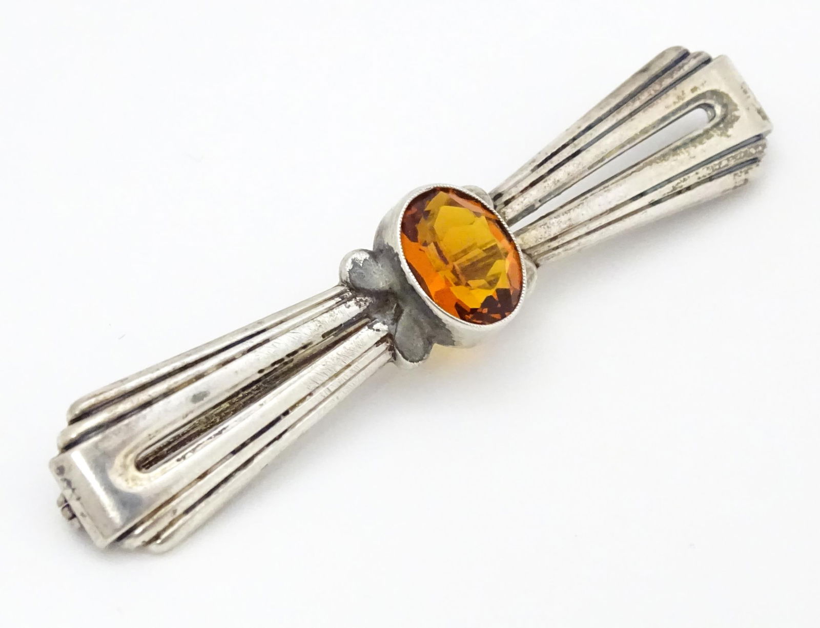 A Continental .835 silver brooch set with central citrine. Indistinctly marked. 2 1/2" wide Please (1 of 7)