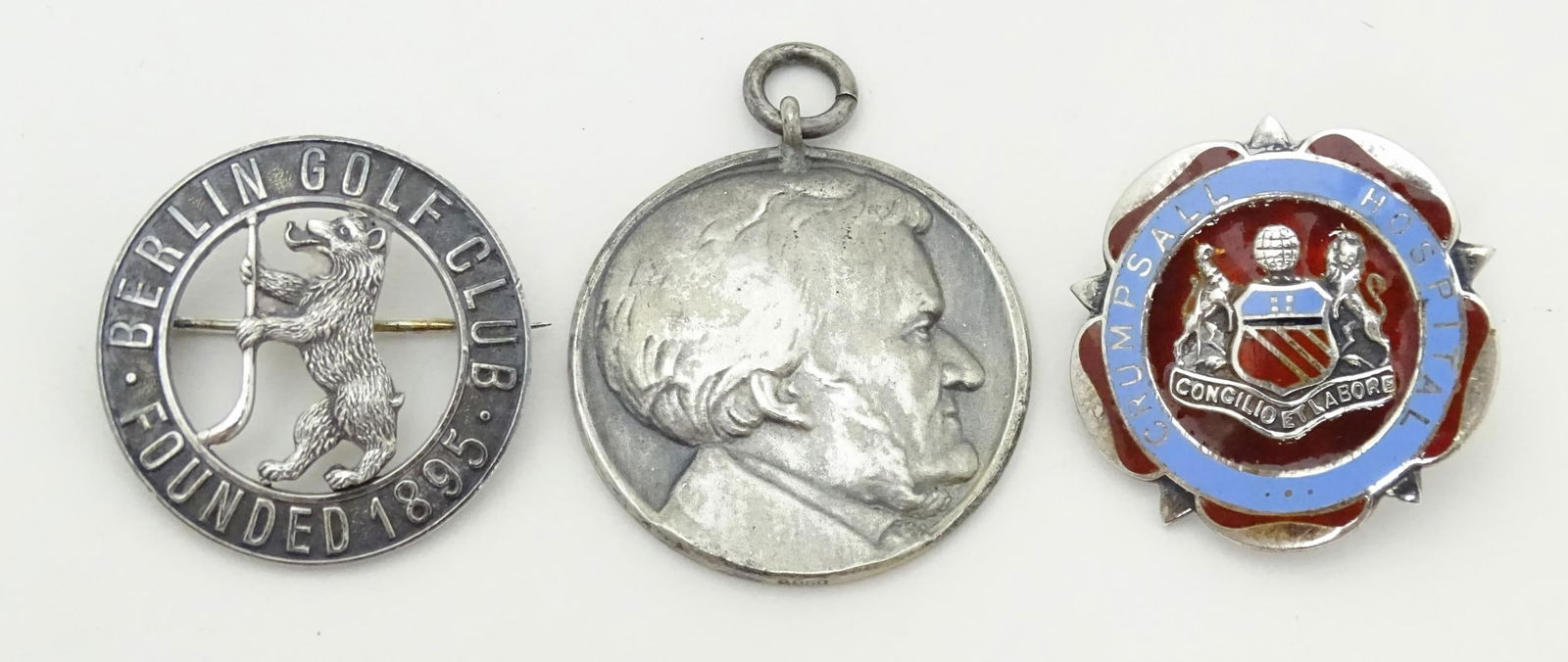 Three assorted items comprising white metal badge titled Berlin Golf Club Founded 1895, a silver (1 of 12)