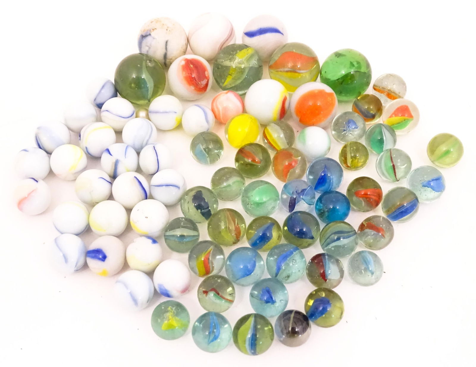 Toys: A quantity of marbles, many with colours twists, etc. Largest approx. 1" Please Note - we do: Toys: A quantity of marbles, many with colours twists, etc. Largest approx. 1"Please Note - we do not make reference to the condition of lots within descriptions. We are however happy to provide addit