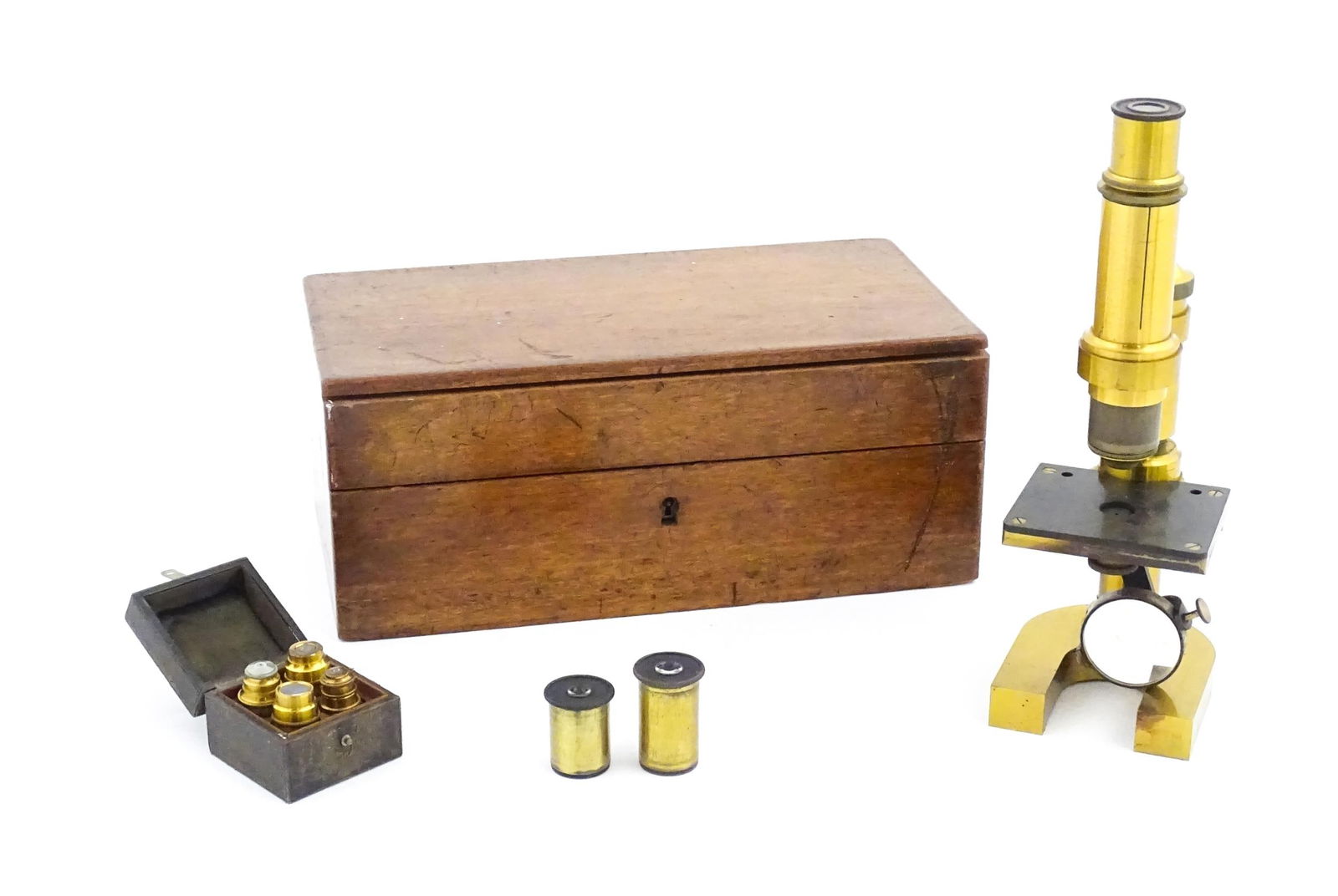 An early 20thC Leitz microscope, constructed from brass with a cast iron base, the mount stamped 'E. (1 of 9)