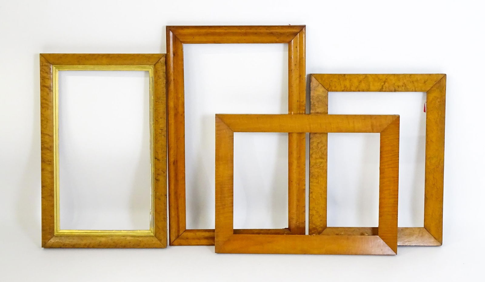 Four various 20thC maple picture frames. Largest aperture approx. 26 1/4" x 14 3/4" (4) Please Note: Four various 20thC maple picture frames. Largest aperture approx. 26 1/4" x 14 3/4" (4)Please Note - we do not make reference to the condition of lots within descriptions. We are however happy to prov