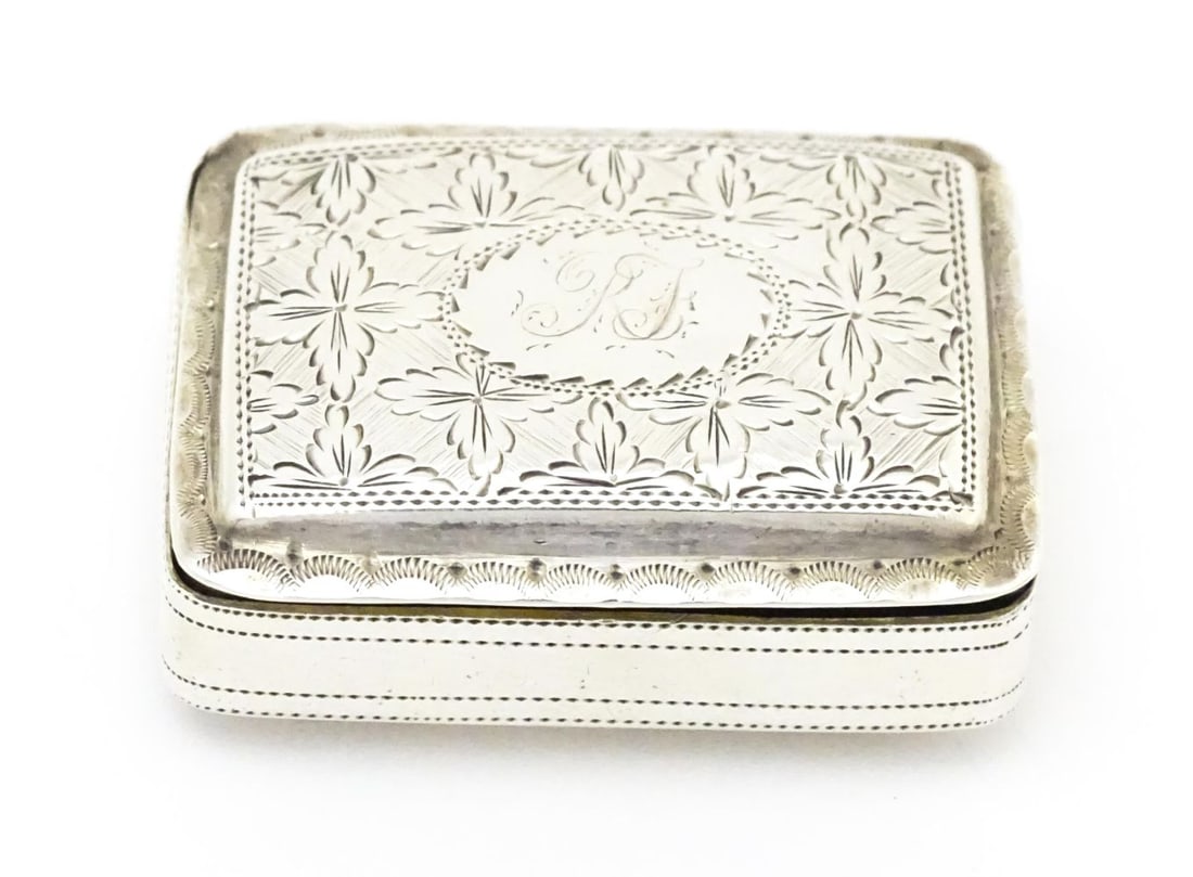 A Geo III silver pill box / vinaigrette case hallmarked Birmingham 1818, maker John Betteridge.: A Geo III silver pill box / vinaigrette case hallmarked Birmingham 1818, maker John Betteridge. Approx. 1 1/2" widePlease Note - we do not make reference to the condition of lots within descriptions.