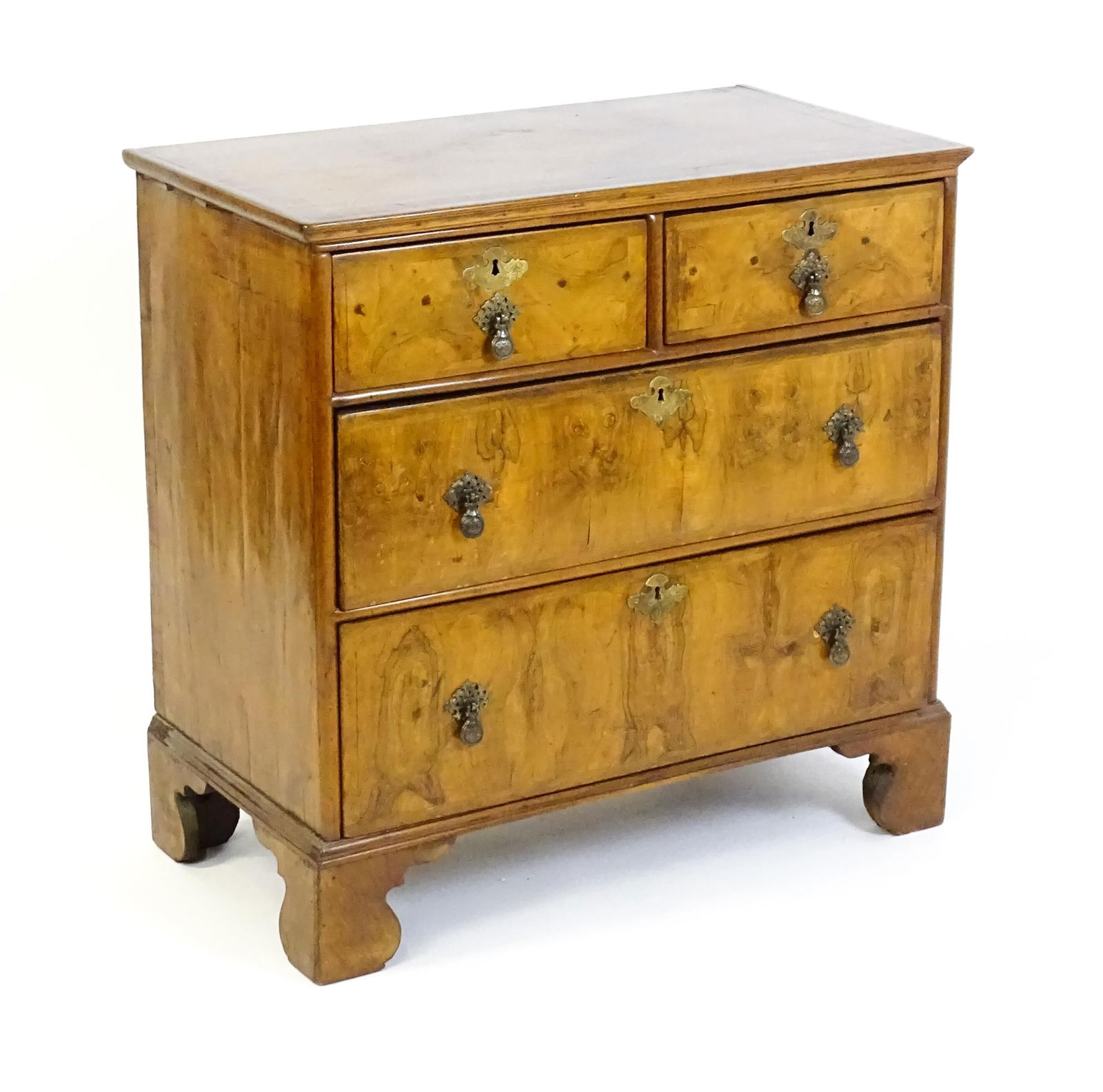 An 18thC walnut chest of drawers with a moulded and crossbanded top above two short over three long (1 of 8)