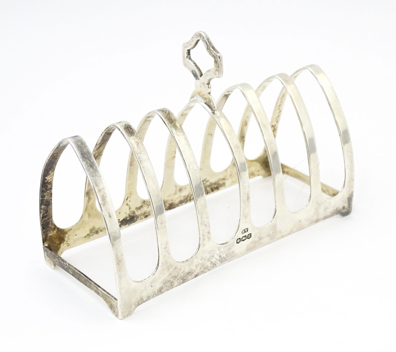A silver seven bar toast rack, hallmarked Sheffield 1937, maker Viner's Ltd. Approx. 4 1/2" long (1 of 7)