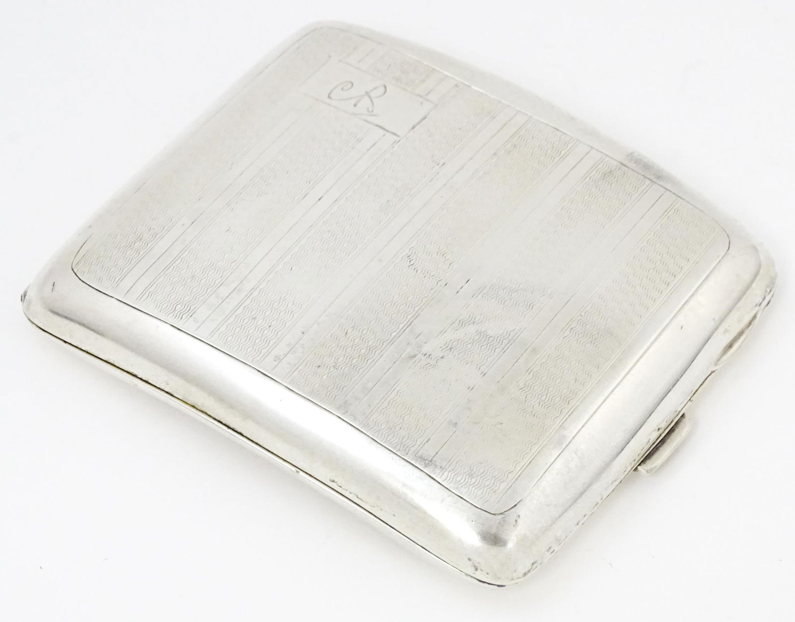 An Art Deco silver cigarette case of shaped form with banded engine turned decoration, Birmingham (1 of 8)
