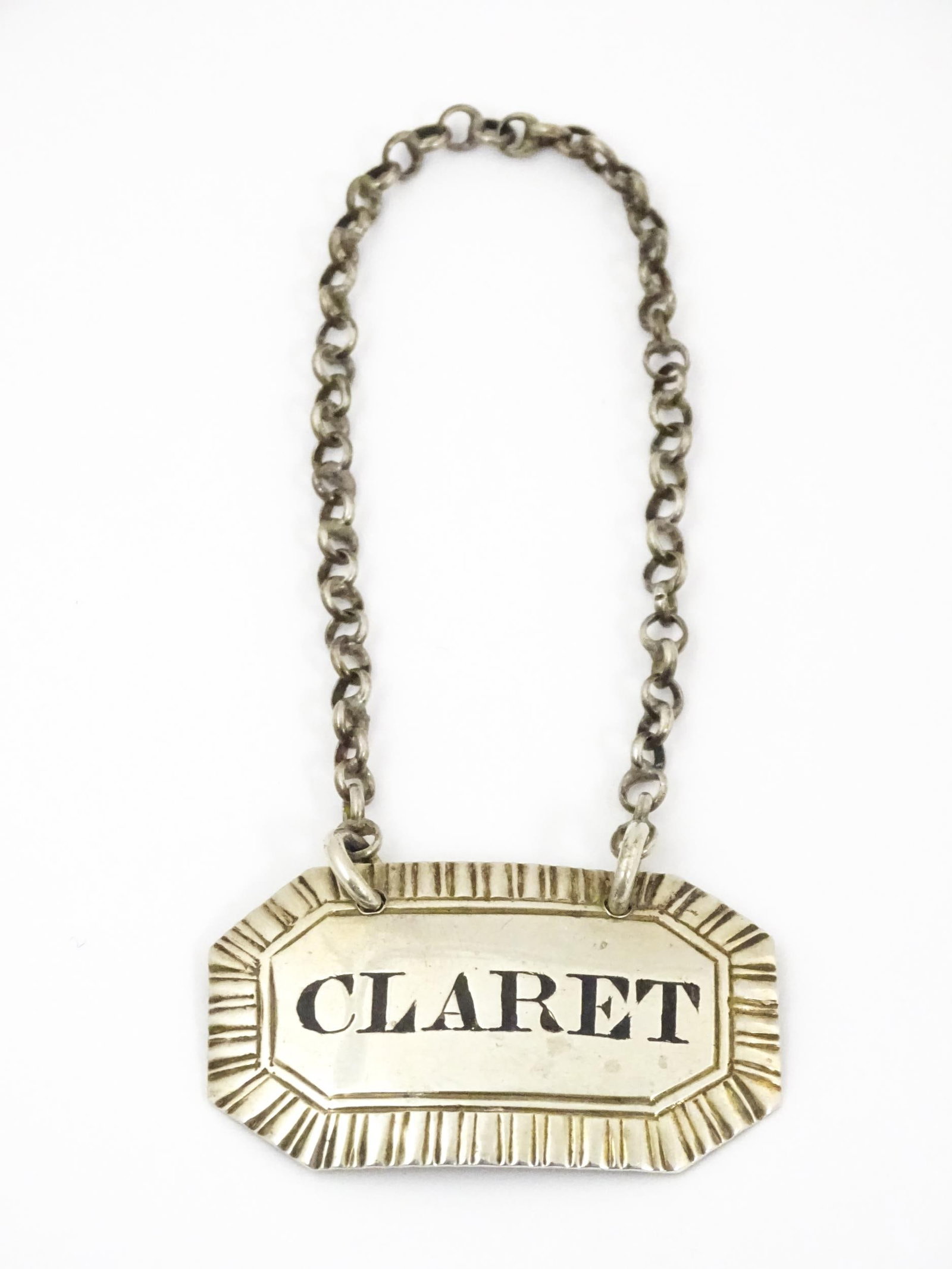A Victorian silver decanter / wine label / bottle ticket for Claret hallmarked London 1839, maker: A Victorian silver decanter / wine label / bottle ticket for Claret hallmarked London 1839, maker Edward Edwards. Approx. 1 3/4" wide Please Note - we do not make reference to the condition of lots wi
