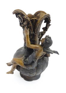 An Art Nouveau case jug with Green Man style mask detail under spout and applied nymph to body,: An Art Nouveau case jug with Green Man style mask detail under spout and applied nymph to body, after Charles Georges Ferville Suan. Cast signature lower. Approx. 13" high Please Note - we do not make