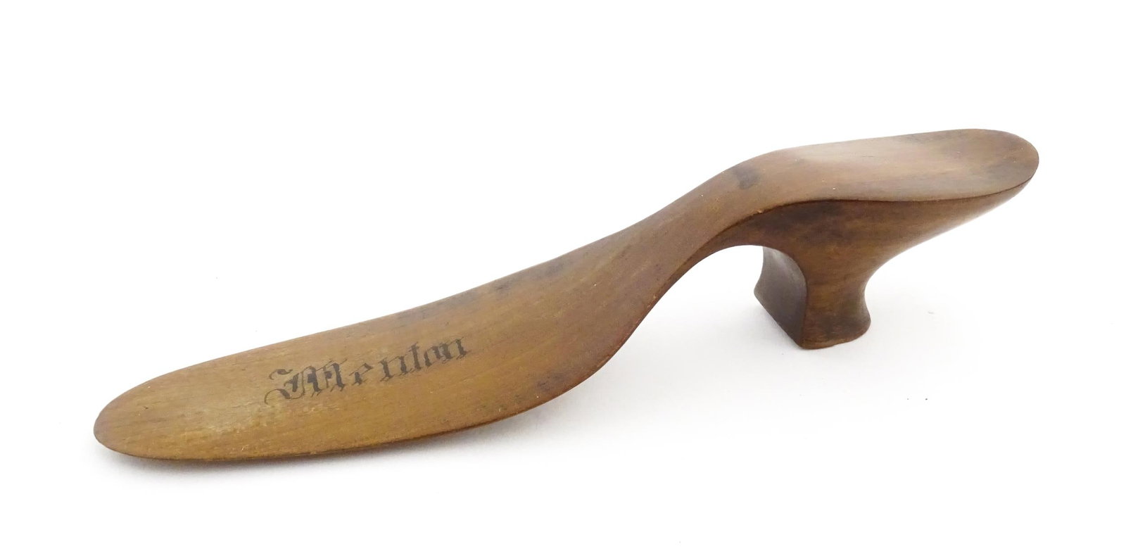 A 19thC French novelty treen souvenir shoehorn modelled as a ladies heeled shoe engraved Menton. (1 of 7)