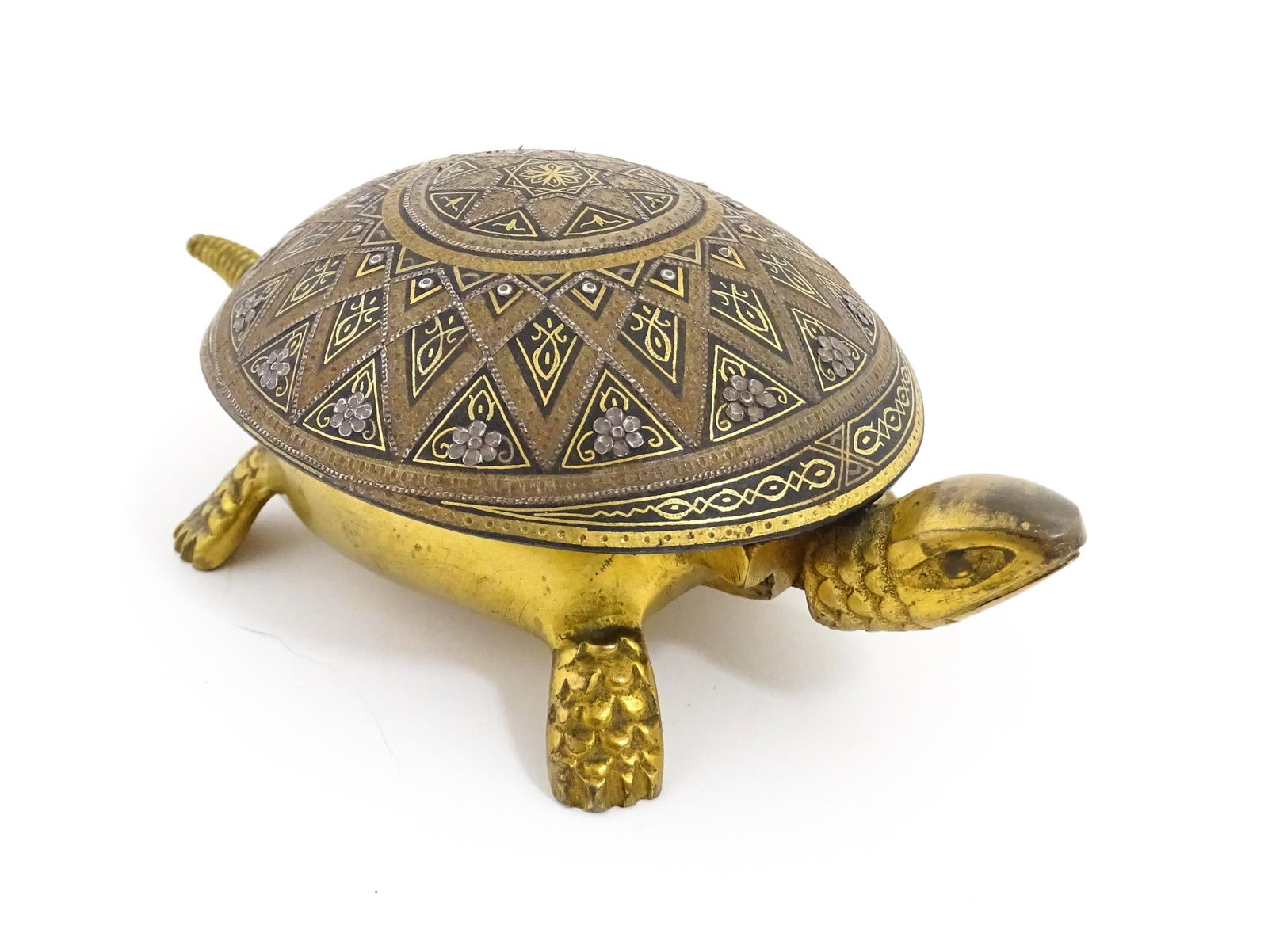 A 20thC novelty clockwork counter bell modelled as a tortoise, the shell with Damascene style: A 20thC novelty clockwork counter bell modelled as a tortoise, the shell with Damascene style decoration to shell. Marked under BOJ PAT No 19536 No 30366. Approx. 5 1/2" longPlease Note - we do not ma