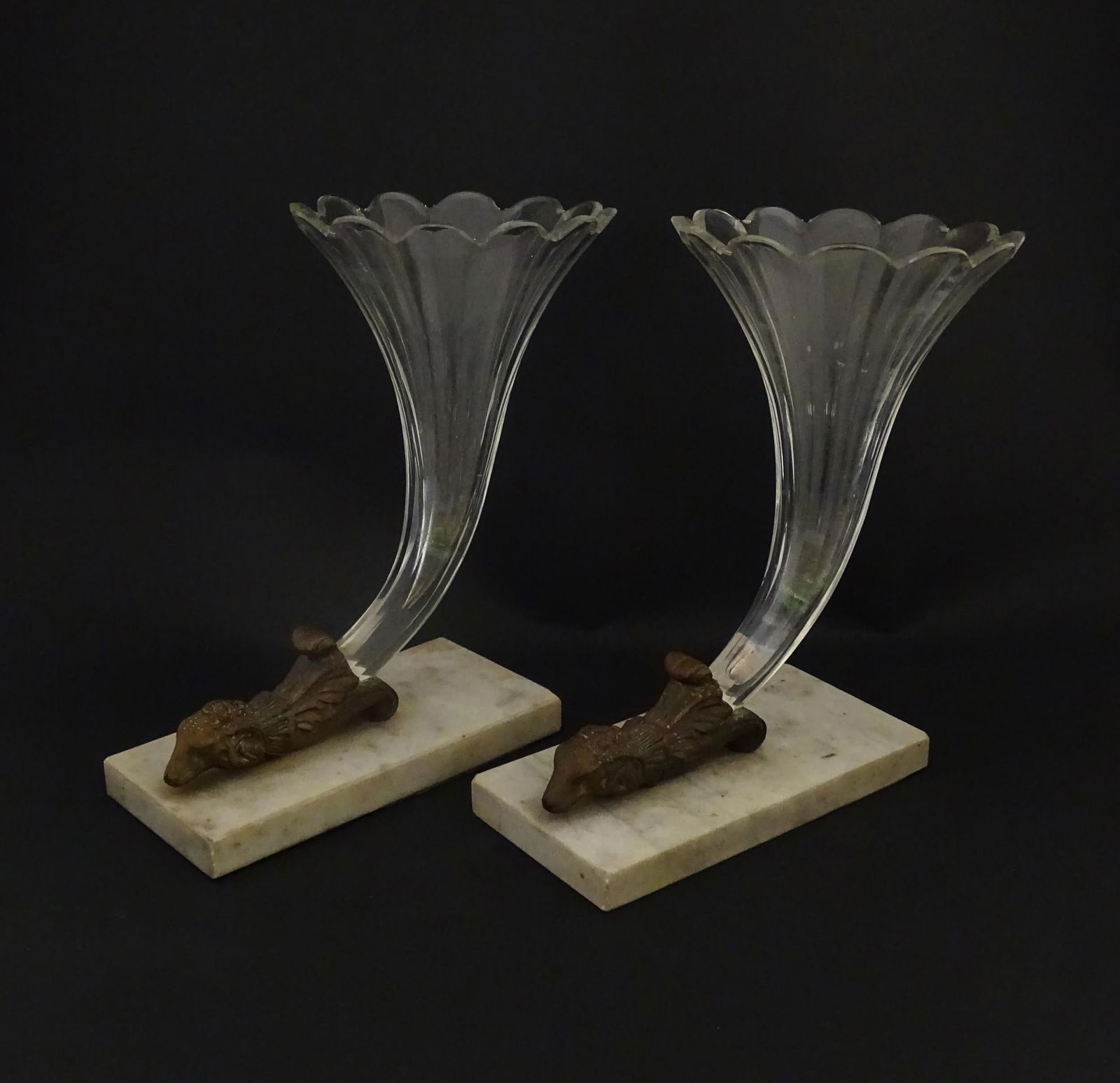 A pair of Victorian epergnes the clear glass flutes with rams head support mounted on a rectangular: A pair of Victorian epergnes the clear glass flutes with rams head support mounted on a rectangular base. Approx. 10 1/2" high overall (2) Please Note - we do not make reference to the condition of lo