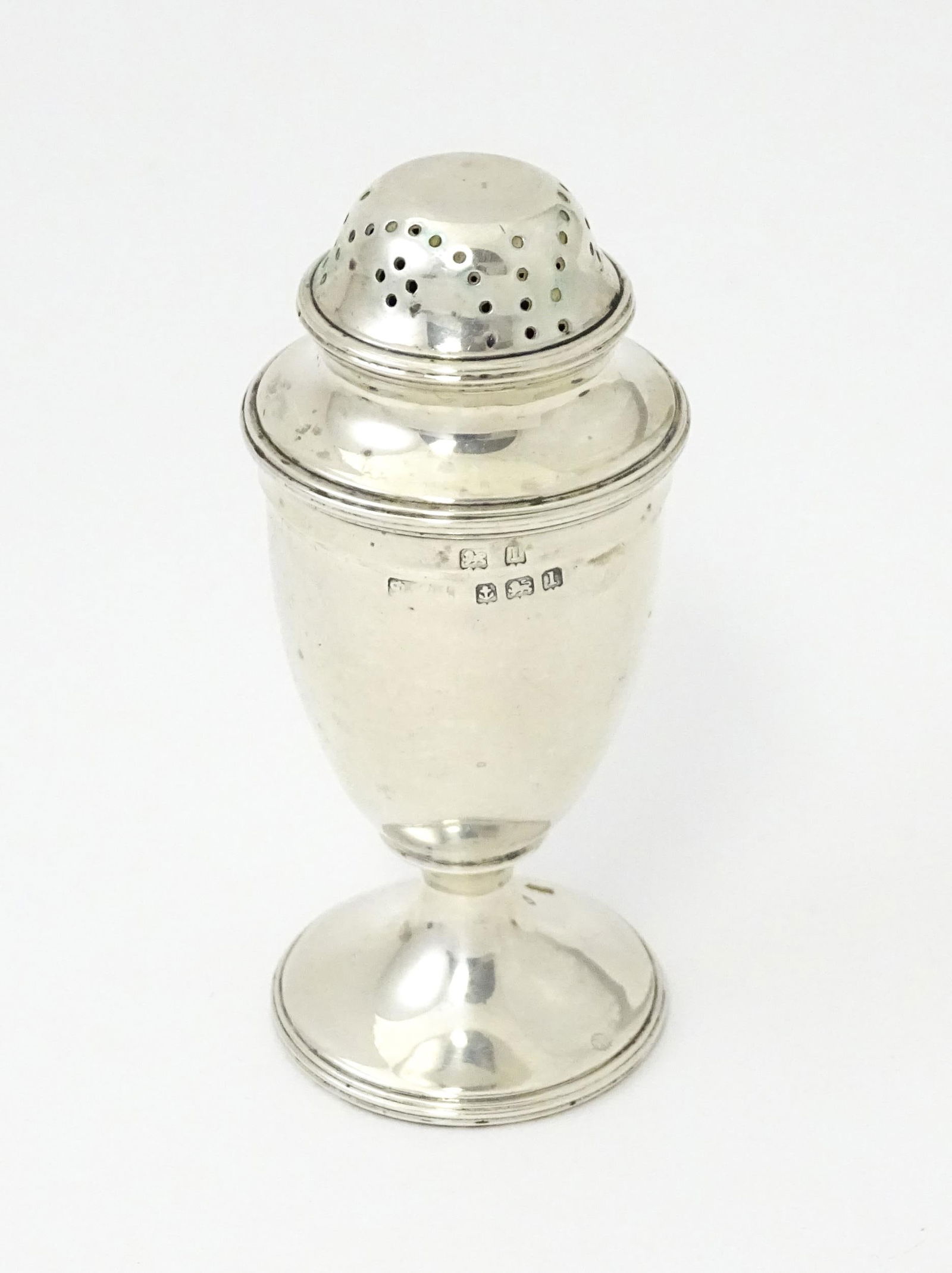 A silver pepper hallmarked Birmingham 1910 maker Philip Hanson Abbot. 3 1/4" high Please Note - we: A silver pepper hallmarked Birmingham 1910 maker Philip Hanson Abbot. 3 1/4" high Please Note - we do not make reference to the condition of lots within descriptions. We are however happy to provide a