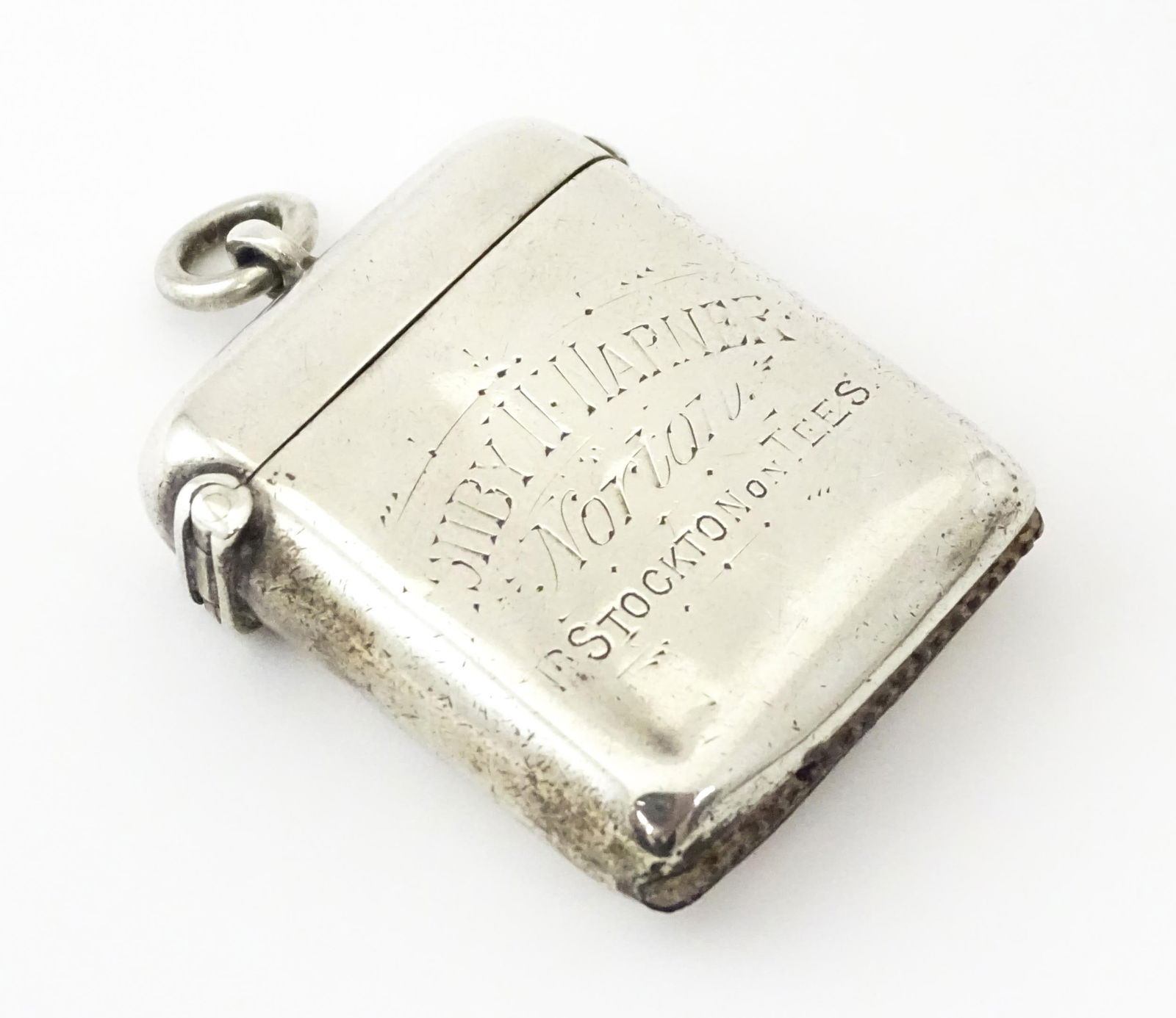 A silver vesta case engraved 'Ashby W Warner, Norton, Stockton on Tees', hallmarked Chester 1900,: A silver vesta case engraved 'Ashby W Warner, Norton, Stockton on Tees', hallmarked Chester 1900, maker William Neale. Approx. 1 1/2" high Please Note - we do not make reference to the condition of lo