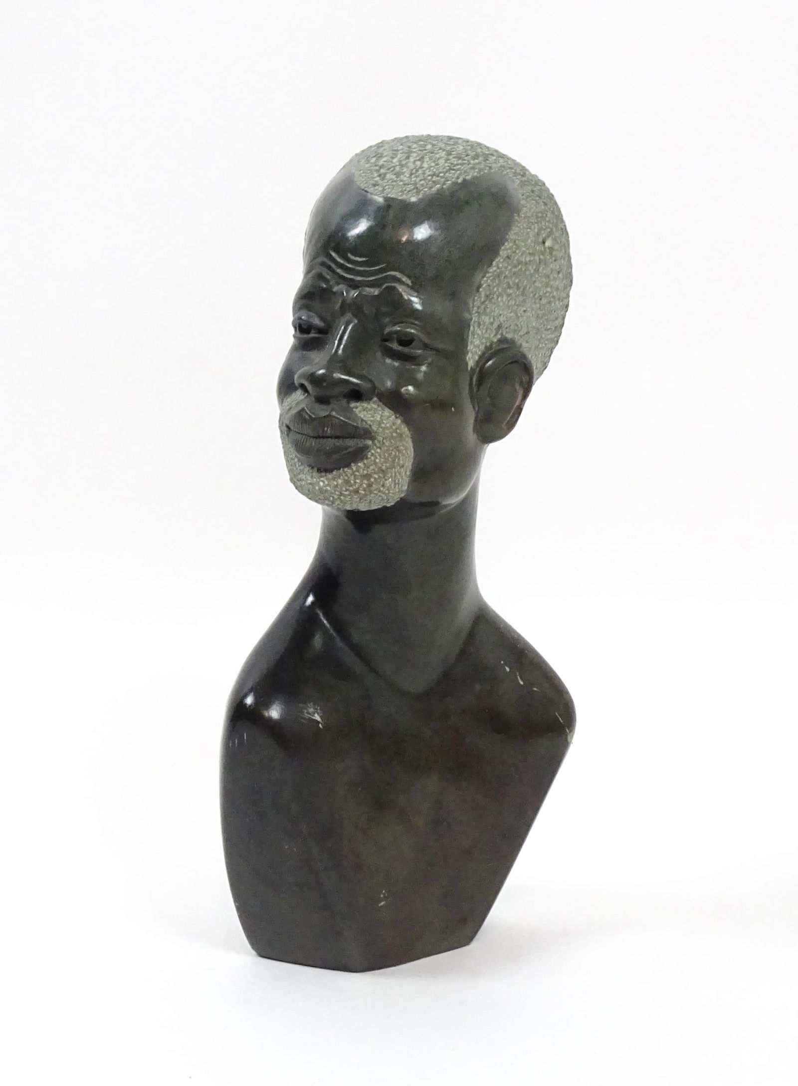 Ethnographic / Native / Tribal : An African carved soapstone bust modelled as the head of a bearded (1 of 7)