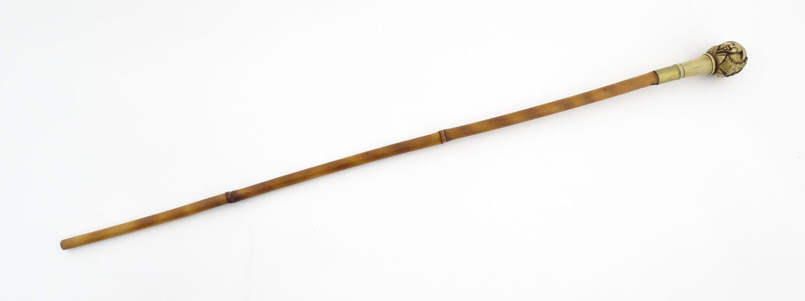 An early 20thC bamboo sword stick / cane with carved resin pommel depicting Oriental figures. (1 of 12)