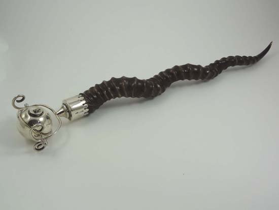 An unusual early 20thC silver cigar table lighter: An unusual early 20thC silver cigar table lighter of gimballed grenade form with a spiral antelope horn handle. Maker William Frederick Wright , London 1920. Approx. 21.1/2" long.