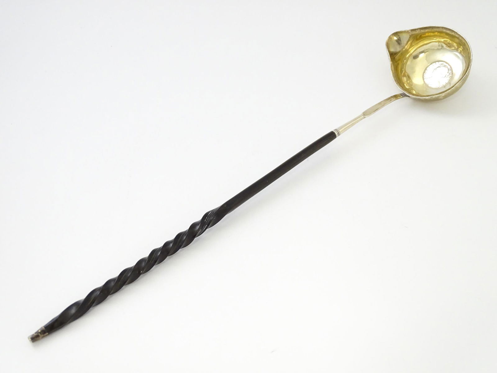 A Silver toddy ladle with coin style detail to bowl depicting Queen Anne. Approx 15" long (1 of 12)