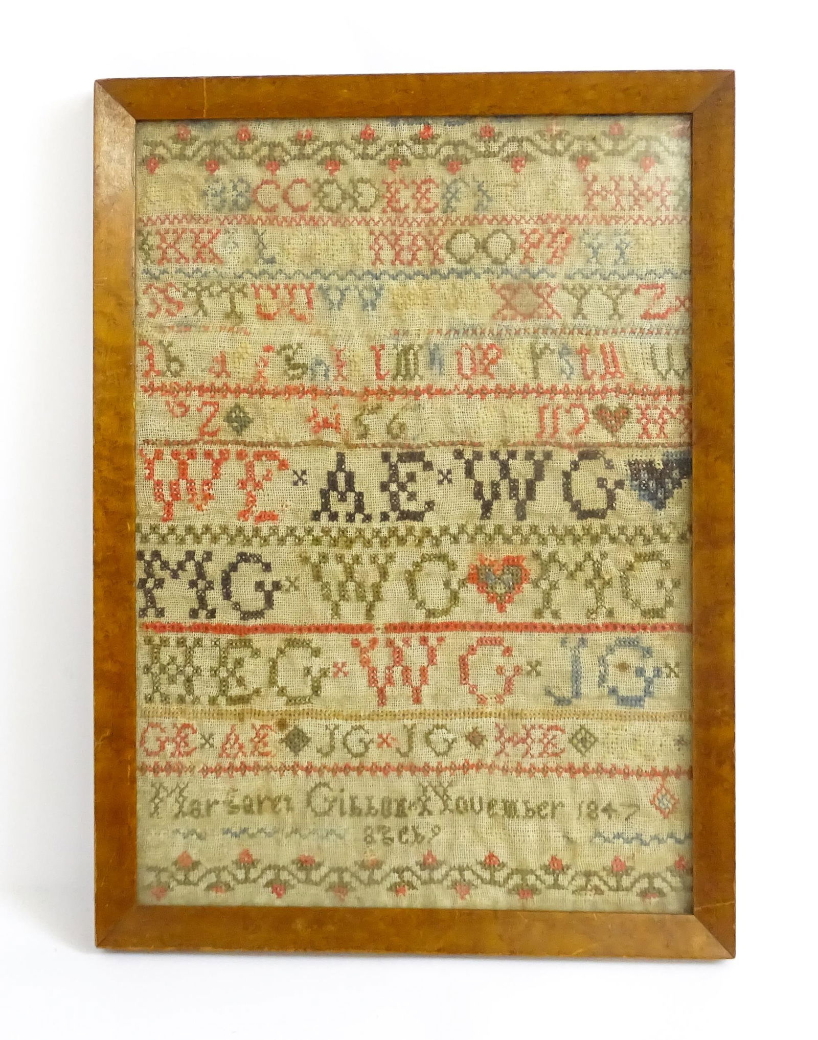 A 19thC needlework sampler with letters of the alphabet and foliate borders, by Margaret Gibbon, (1 of 5)