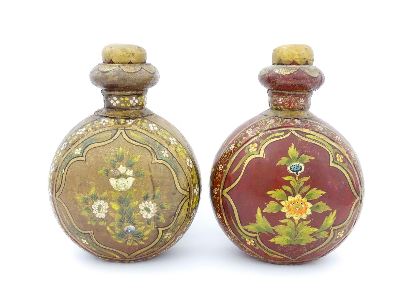 Two Indian metal vases of moon flask form decorated with flowers and foliage. Approx. 10" high (2): Two Indian metal vases of moon flask form decorated with flowers and foliage. Approx. 10" high (2)Please Note - we do not make reference to the condition of lots within descriptions. We are however ha