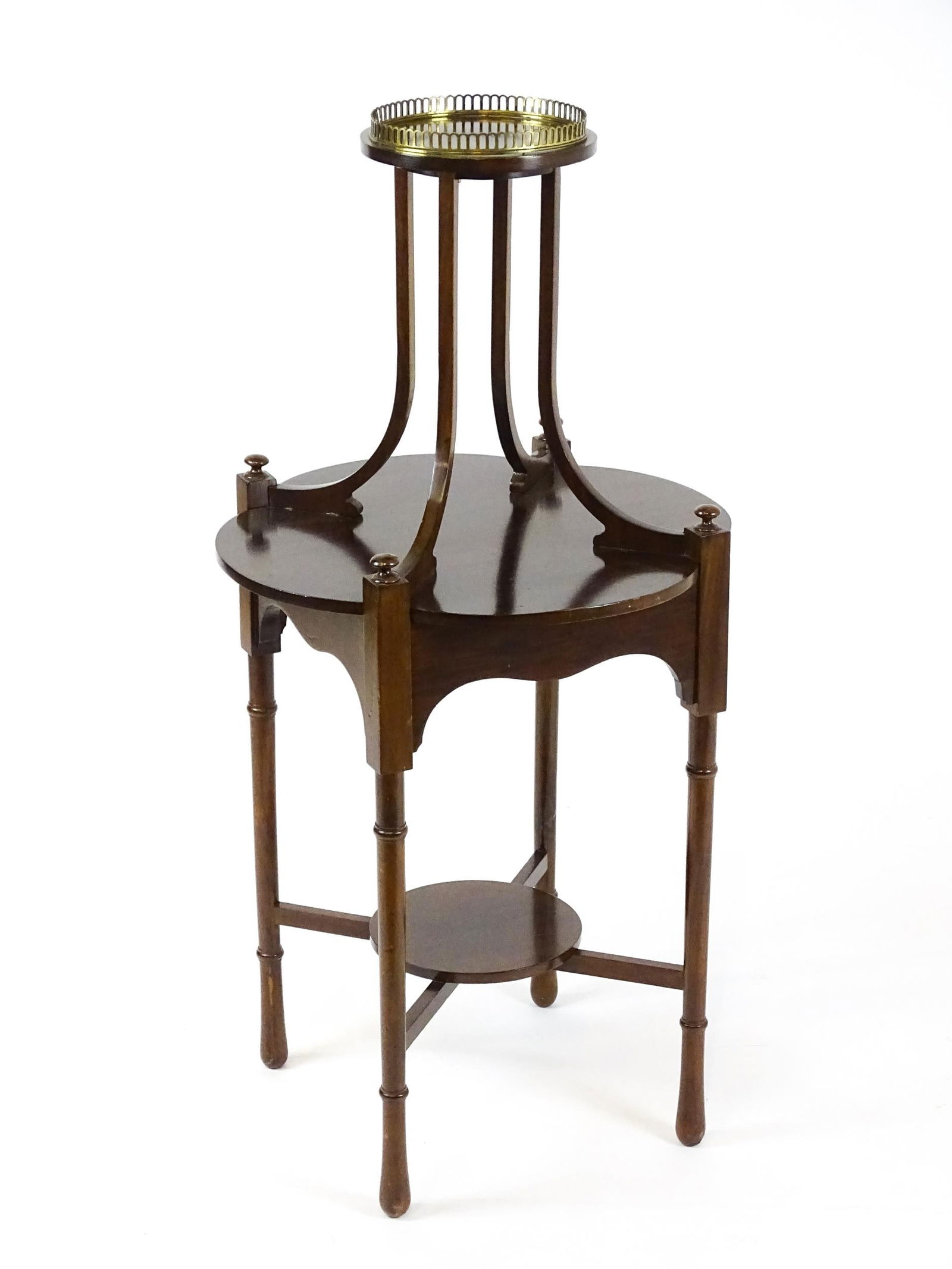 An Edwardian mahogany centre table, having a circular upper tier with a brass galley raised on four (1 of 6)