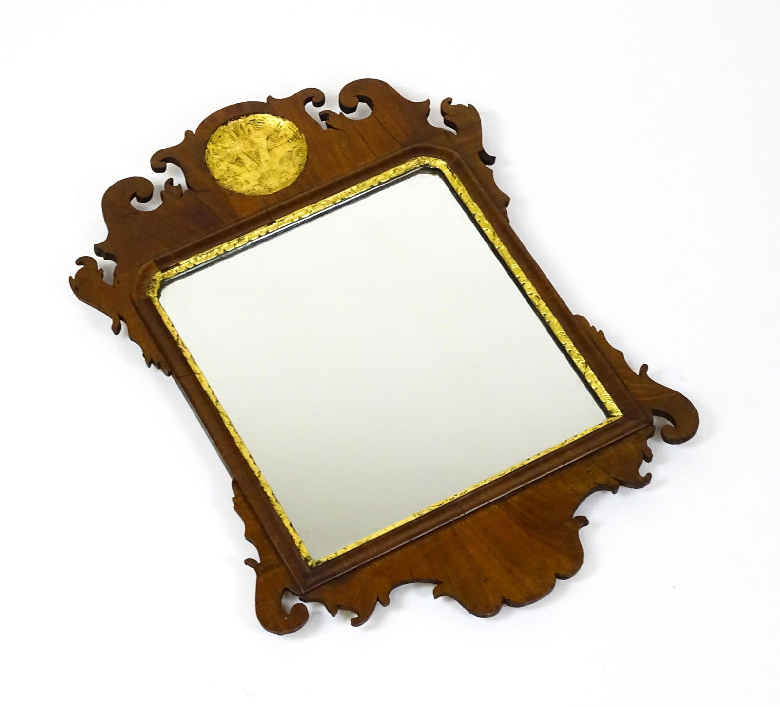 A 19thC mahogany wall mirror with scrolled detailing and gilt anthemion moulding. 20" wide x 27" (1 of 5)