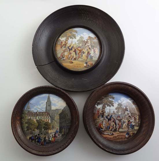 Pot lid : Three 19thC Prattware pot lids in woode: Pot lid : Three 19thC Prattware pot lids in wooden frames two entitled The Village Wedding, one a later issue, and the other French Street Scene issued by F and R Pratt for Messrs. Crosse and Blackwel