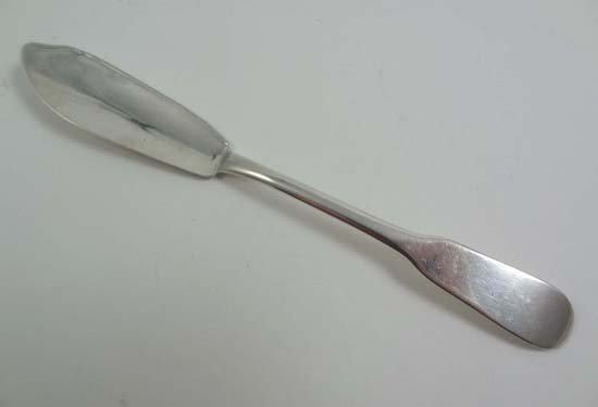A Geo III HM silver fiddle pattern butter knife Lo: A Geo III HM silver fiddle pattern butter knife London 1801 maker William Eley and William Fearn 7 1/4" long (26g)