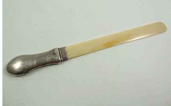 A HM silver handled page turner / paper knife . B: A HM silver handled page turner / paper knife . Birmingham 1904 maker William Harrison Walter 10" long