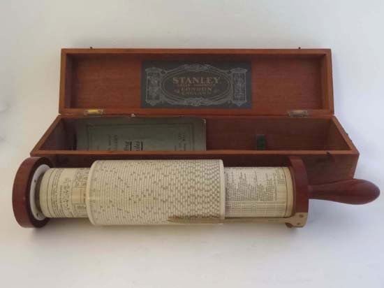 Scientific Instrument : A superb 1928 Fullers Calc: Scientific Instrument : A superb 1928 Fullers Calculator in mahogany and brass within a mahogany case, complete with an instruction book and the brass bracket to fix it upon its case for use.