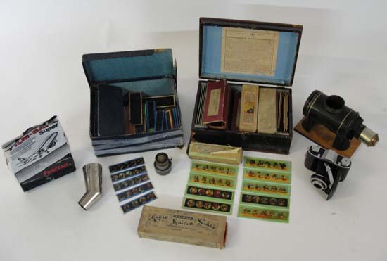 A large quantity of 19thC magic lantern slides of: A large quantity of 19thC magic lantern slides of various cartoons, humorous, wild animals, ethnology, caricatures etc, including two German boxed sets, one painted wooden, and a viewer, together with