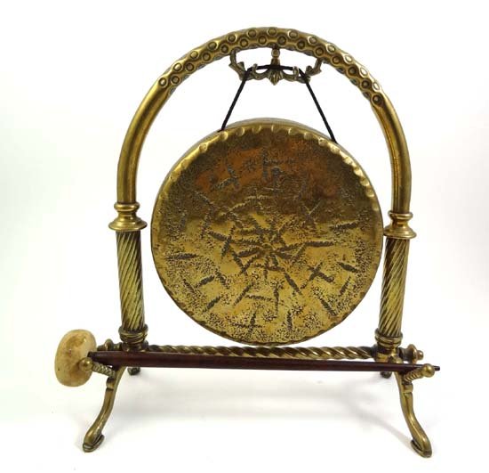 A late 19thC cast brass table gong and beater 10 1: A late 19thC cast brass table gong and beater 10 1/2" high
