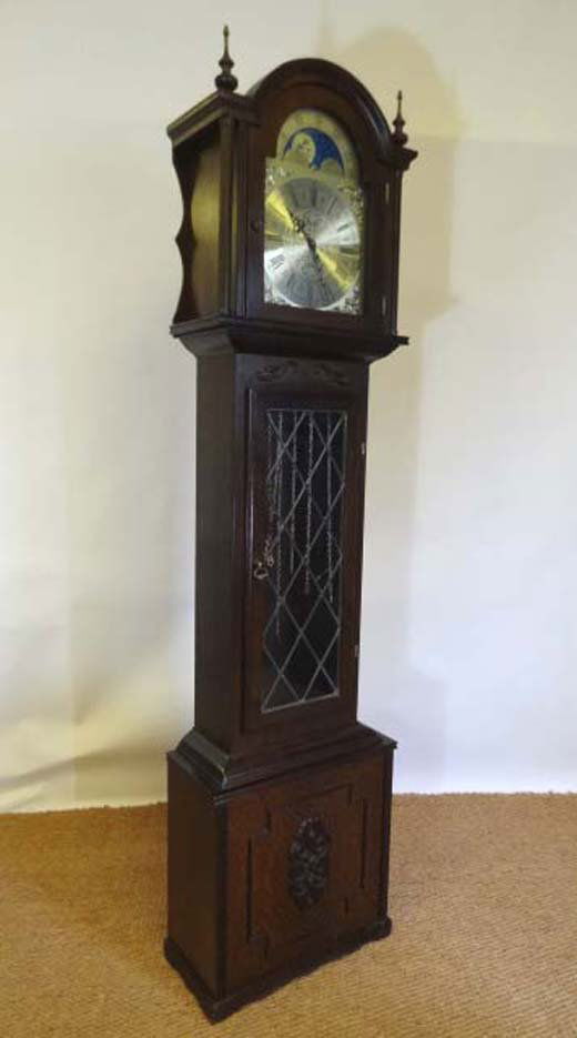 Fenclocks , Suffolk : a modern (circa 1970) 3 trai: Fenclocks , Suffolk : a modern (circa 1970) 3 train oak cased long case clock standing 6' 2" high with a glased trunk door and containing a 3 brass weight driven 8 day movement fronted by a decorative
