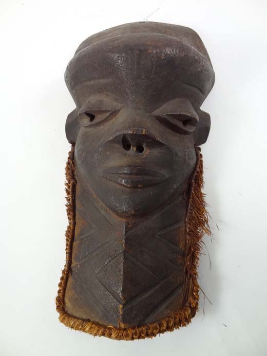 An African Native Tribal mask, the carved wooden f: An African Native Tribal mask, the carved wooden face possibly a Pende mask, 12" high