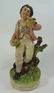 A Victorian Staffordshire figure known as Bird Nesting,