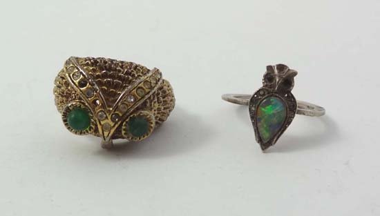 Owl jewellery : A gilt metal ring with owl head detail: Owl jewellery : A gilt metal ring with owl head detail and a white metal ring set with opal and marcasite