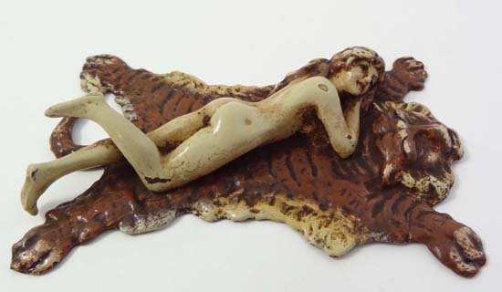Franz Bergman : A Vienna cold painted bronze of a naked: Franz Bergman : A Vienna cold painted bronze of a naked lady lying upon a tiger skin rug marked ' Greb ' under 4 3/4" long