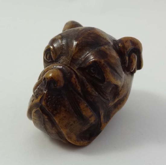 A c.1900 novelty walking stick handle in the form of a: A c.1900 novelty walking stick handle in the form of a novelty boxer dog head 2 1/4" long