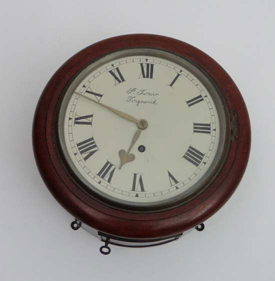 A John Walker London c. 1900 an 8" round dial mahogany: A John Walker London c. 1900 an 8" round dial mahogany cased single train fusee wall clock. An ex-railway clock but now showing the name of P Turner of Tingewick (near Buckingham) it is understood tha
