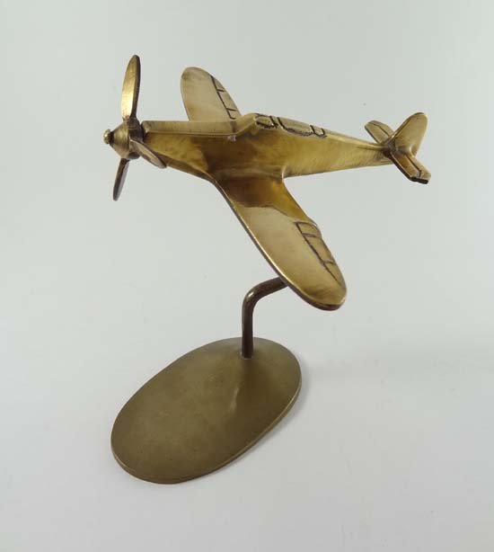 Trench Art : a WWII brass aeroplane mounted upon a stan: Trench Art : a WWII brass aeroplane mounted upon a stand. approx 5 1/2" high