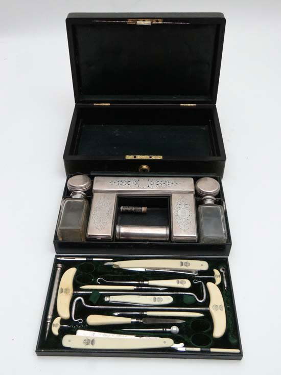 Stowe House Ducal Collection: A 'J. Bramah 124 Piccadil: Stowe House Ducal Collection: A 'J. Bramah 124 Piccadilly' gilt metal locked and seven point coronet over monogram Baronial dressing box with carry handle: The lid with easel mirror First lift out tra